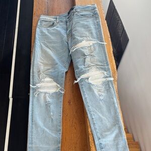 Amiri rip and repaired light blue denim white leather patches size 32